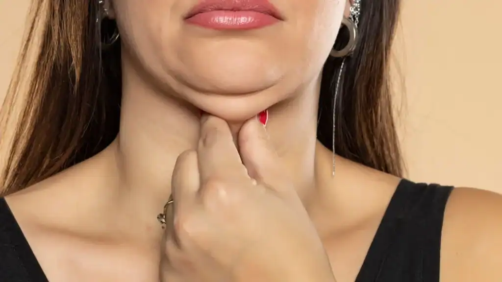 An image of a woman with double chin, sad, worried : Non Surgical Double Chin Removal Treatment in Tetbury, UK