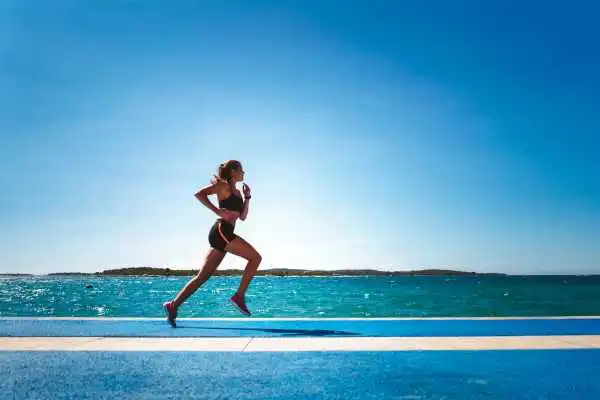 Woman running showing strong leg muscle Tetbury